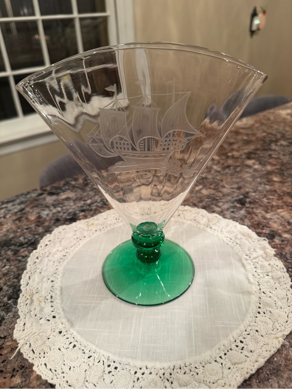 A Steuben glass fan vase with intaglio etched ship and green uranium ribbed foot
